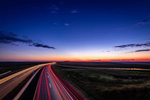 Rural state highway at sunset